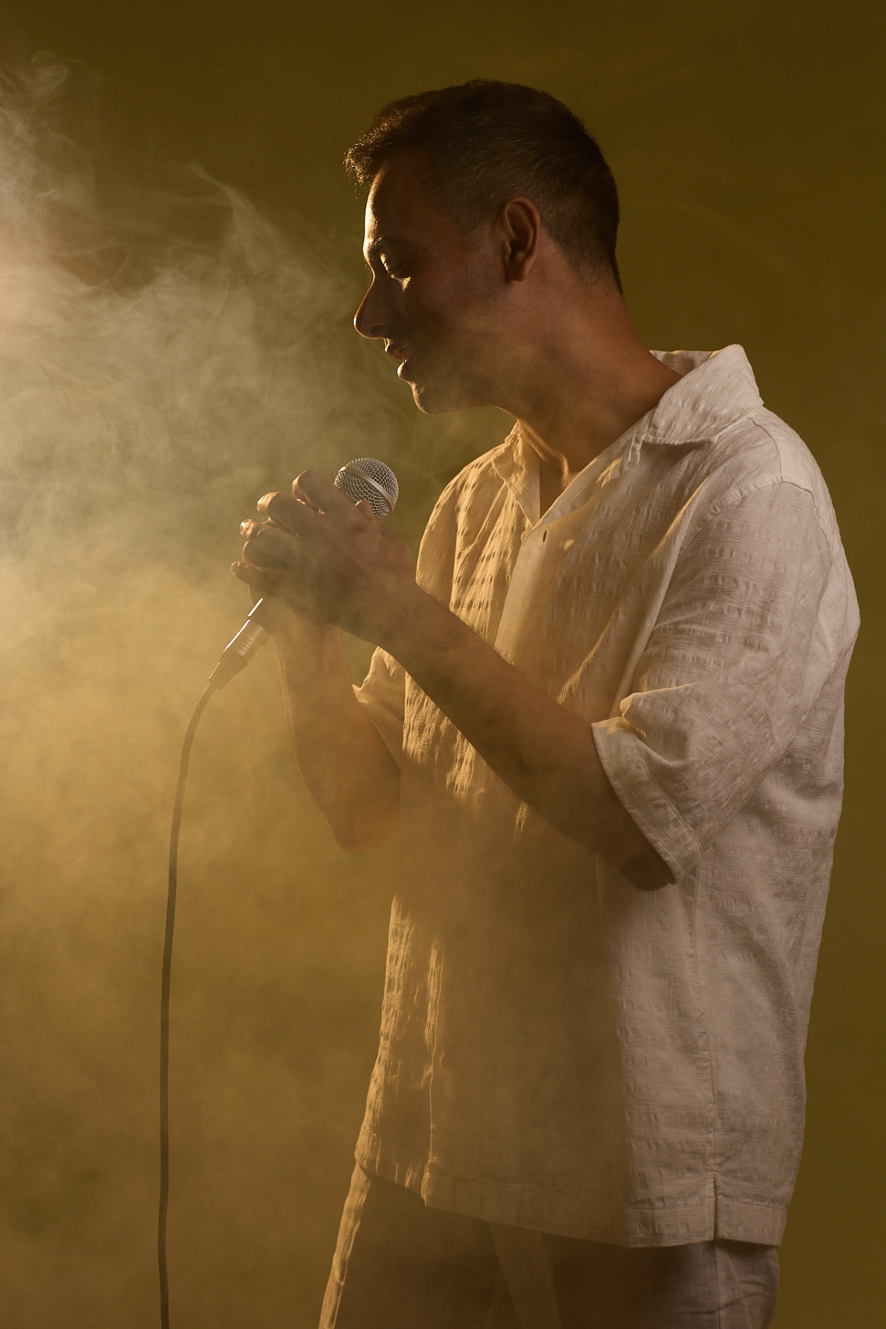 RJSoulflow performing in warm golden light